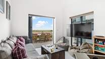 A cosy snug/games-room makes up the ground floor and has a double sofa bed, should this be required.