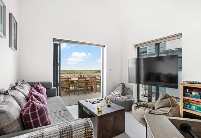 A cosy snug/games-room makes up the ground floor and has a double sofa bed, should this be required.