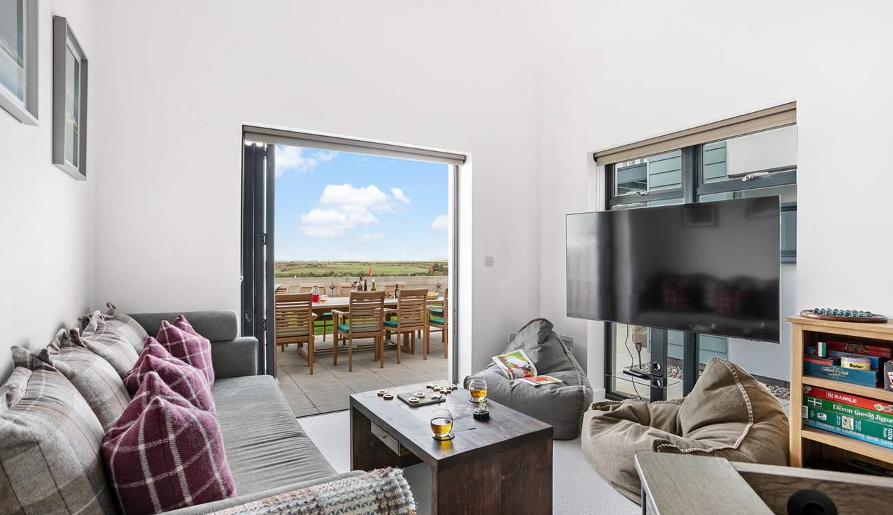 A cosy snug/games-room makes up the ground floor and has a double sofa bed, should this be required.