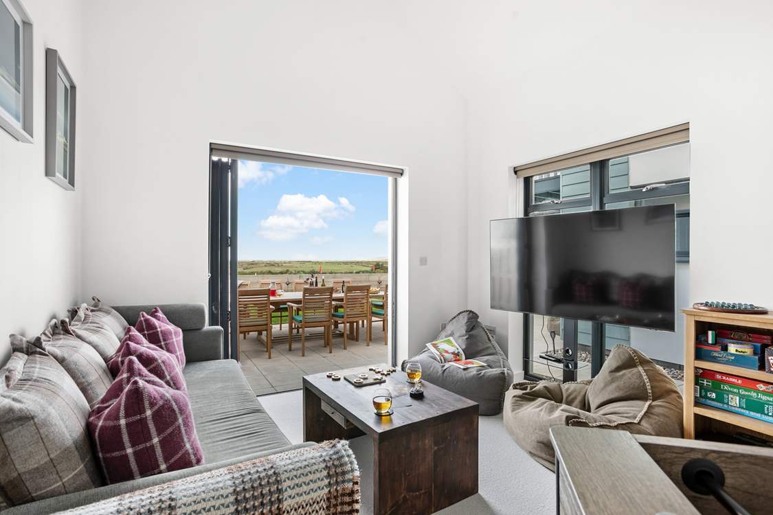 A cosy snug/games-room makes up the ground floor and has a double sofa bed, should this be required.