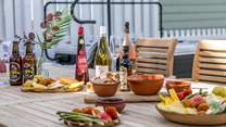 Sample some of the local delicacies at the fantastic wooden dining area.