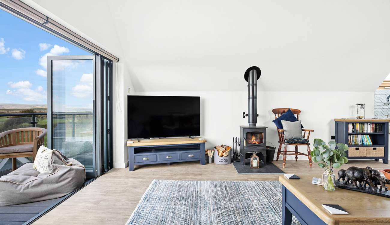 A beautiful wood-burner ensures the room stays nice and cosy in the evenings whilst you snuggle down and watch a film on the Smart TV!