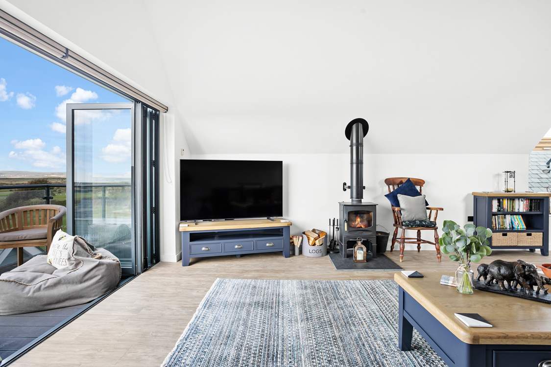 A beautiful wood-burner ensures the room stays nice and cosy in the evenings whilst you snuggle down and watch a film on the Smart TV!