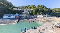Visit Clovelly, a picturesque village with steep cobbled streets and a lovely harbour.