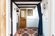 The charm continues with the beautiful restored door and fabulous tiled floor.