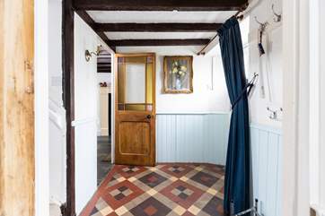 The charm continues with the beautiful restored door and fabulous tiled floor.