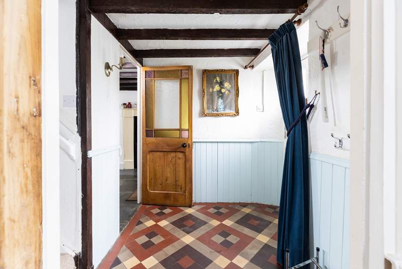 The charm continues with the beautiful restored door and fabulous tiled floor.