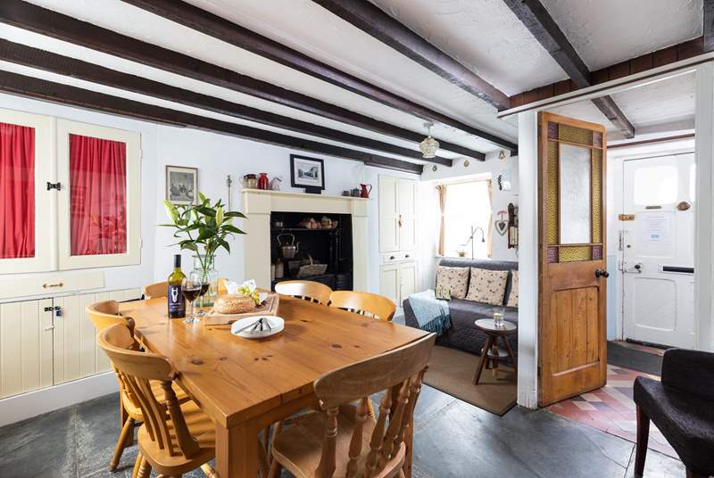 The separate dining-room has an original ornamental range and flagstone floors.