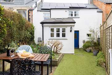The rear garden is ideal for al fresco dining.