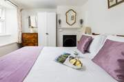 Pretty bedroom 2 with views over the back garden.