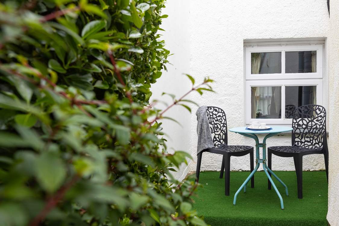 The rear garden is ideal for al fresco dining.