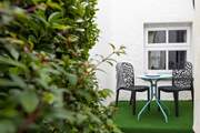 The rear garden is ideal for al fresco dining.