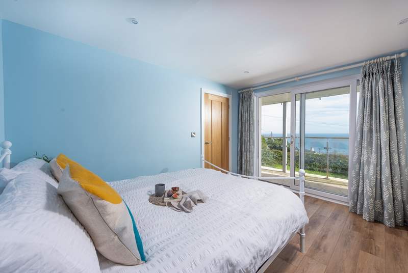 Bedroom 2 is a king room with beautiful sea views and access out to the balcony.