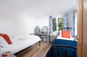 Bedroom 4 is a twin room with a handy desk space.