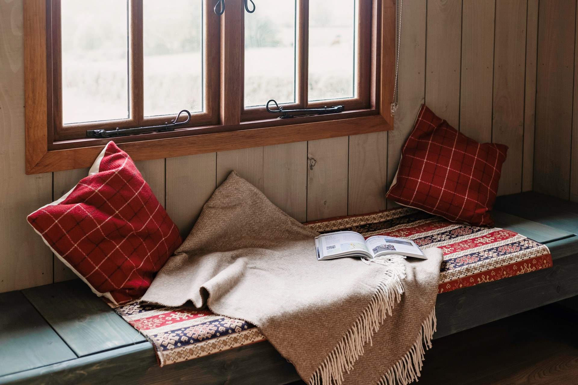 This bench seating area can be transformed into a single bed if you have a little one with you.