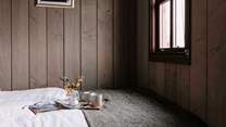 Admire the sweeping countryside views from the sumptuous double bed, cup of coffee in hand. 