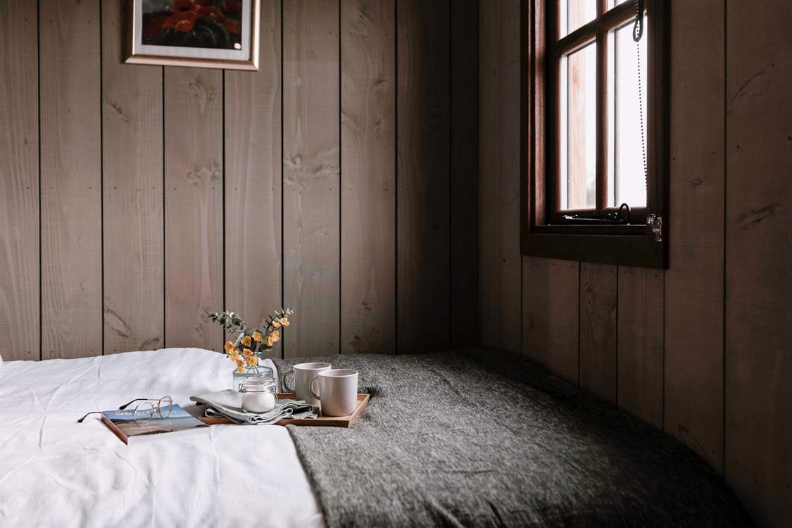 Admire the sweeping countryside views from the sumptuous double bed, cup of coffee in hand.