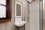 The sleek shower-room is perfect for freshening up after a day of exploring your glorious surroundings.