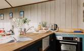 Rustle up a delicious meal in the kitchen, covering the sink for extra countertop space! - Thumbnail Image