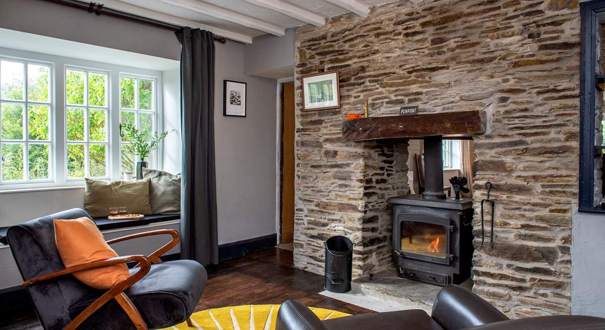 The toasty wood-burner sits between the sitting/dining-room and snug.