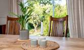 Patio doors lead out from the dining area out to the garden. - Thumbnail Image