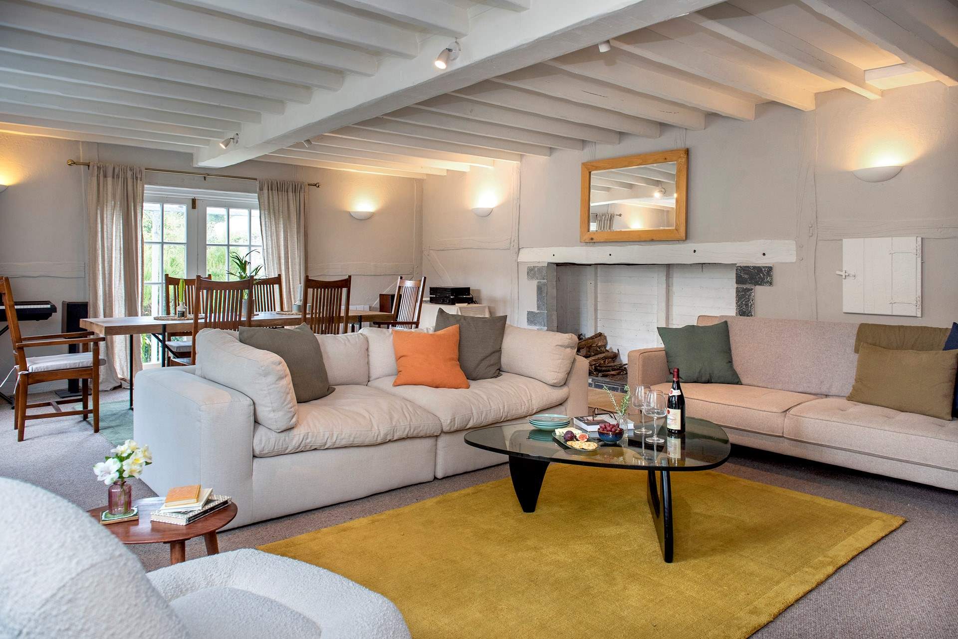 The spacious sitting/dining-room has plenty of space for all to gather and relax.