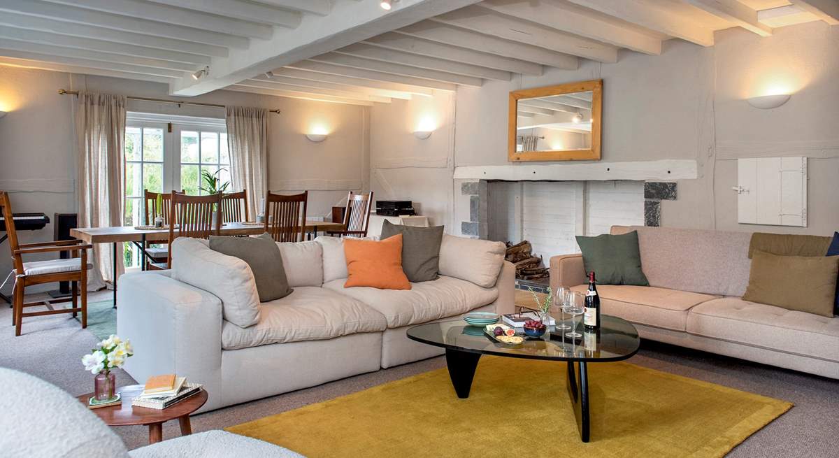 The spacious sitting/dining-room has plenty of space for all to gather and relax.
