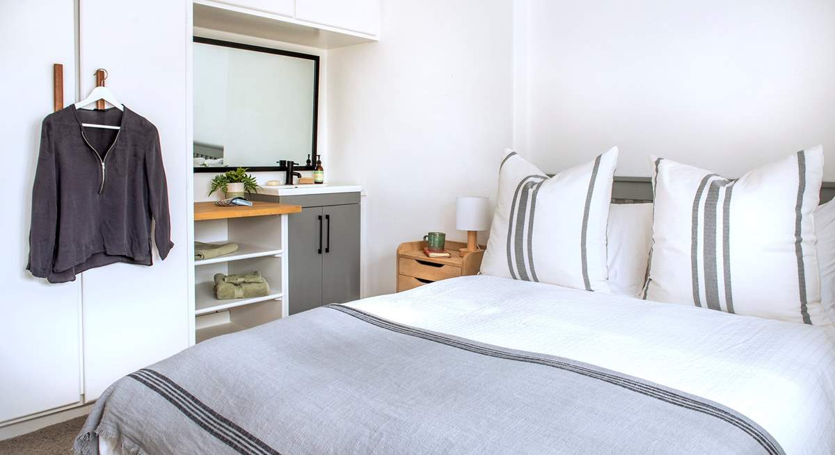 Restful tones in bedroom four.