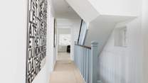 The first three bedrooms and bathroom are accessed off this lovely landing area.