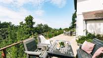 The terrace stretches out across the breadth of the house.