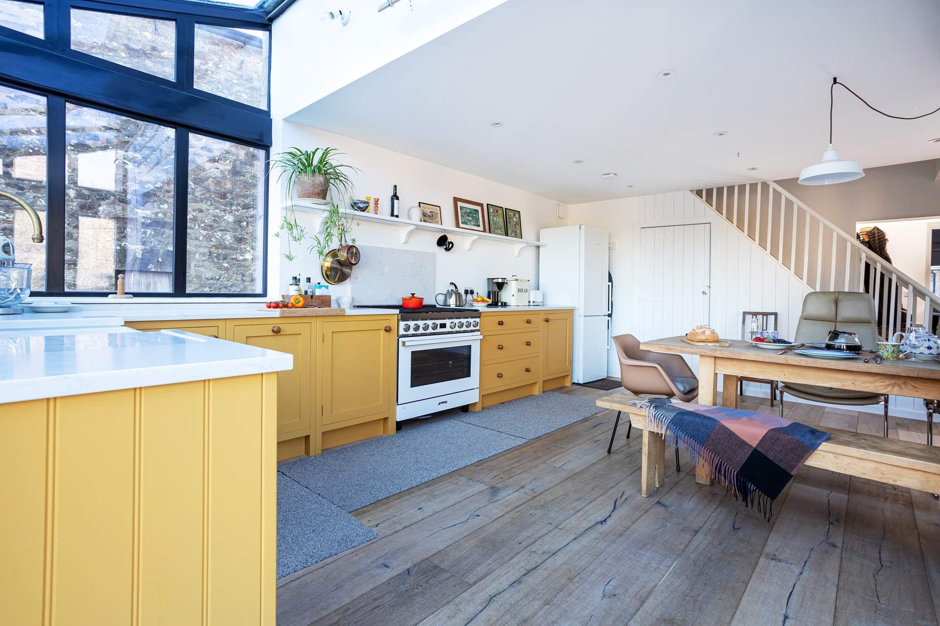 Inspired by vintage farmhouse kitchens and mid-century design, this space is delightfully put together.