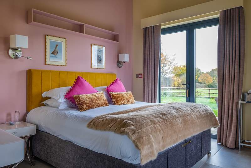 The 'Partridge' bedroom with doors that lead to the terrace and views over the Kent countryside.