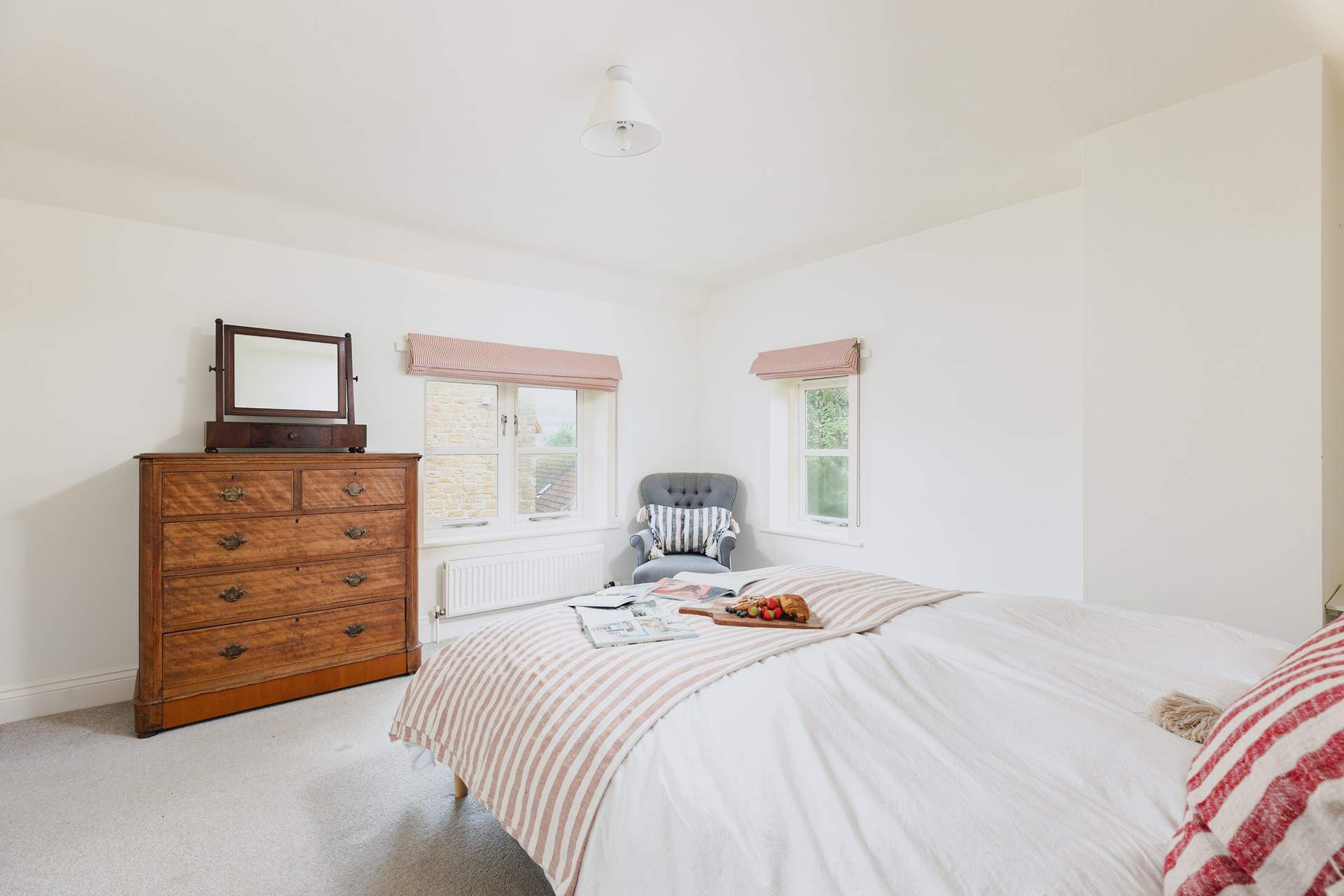 The beautiful main bedroom is flooded with light.