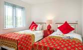 Wonderfully bright throws and cushions adorn the beds in the twin bedroom (6) - Thumbnail Image