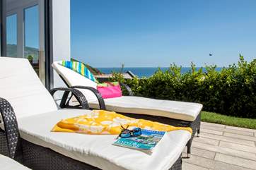 While away an afternoon relaxing on the loungers