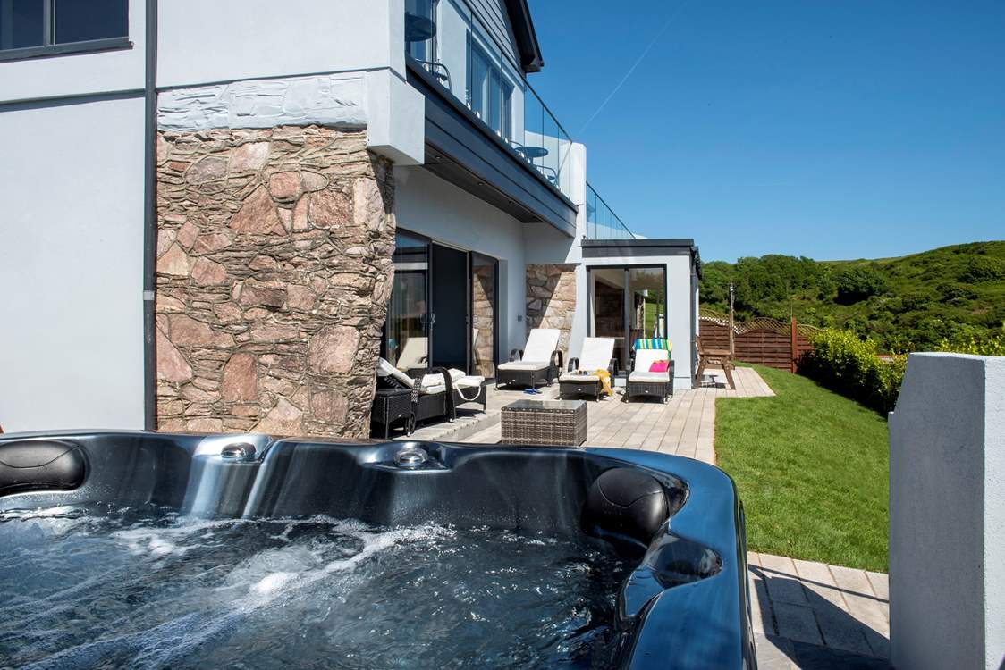 Chill out on the sunny south-facing terrace with it's bubbling hot tub