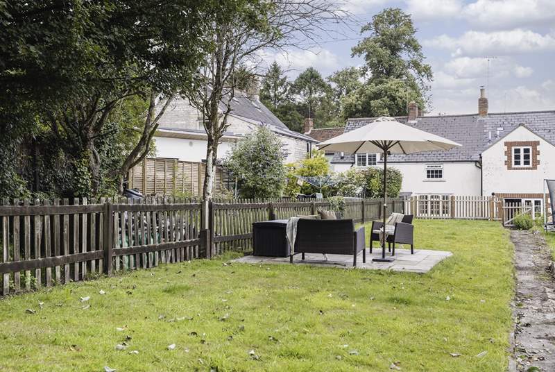 The garden backs onto fields and is a lovely space to enjoy. Note that the property is currently fenced on one side only and the neighbour's garden starts just to the right of the visible path. Dogs need to be kept on a lead and children supervised.