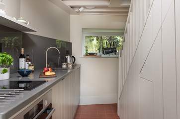 The stairs lead up from the kitchen to the bedroom