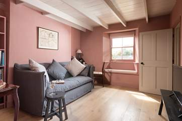 Snuggle up on the sofa in the snug with a good book or to catch up on some holiday TV