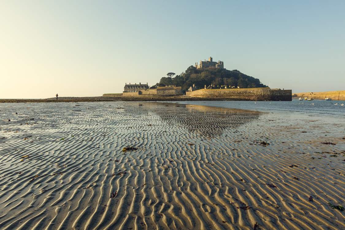 Explore iconic St Michael's Mount where you can walk along the causeway at low tide and catch a ferryboat when the tide is high.