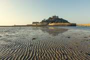 Explore iconic St Michael's Mount where you can walk along the causeway at low tide and catch a ferryboat when the tide is high.