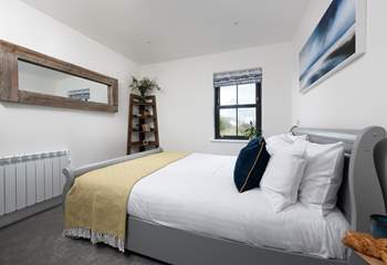 The fabulous double bedroom has a king-size sleigh bed and luxury linens for a great night's sleep.