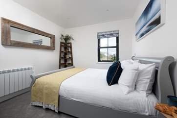 The fabulous double bedroom has a king-size sleigh bed and luxury linens for a great night's sleep.