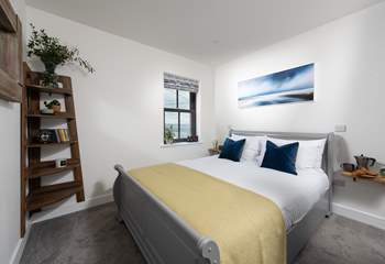 The luxurious double bedroom has sea views.
