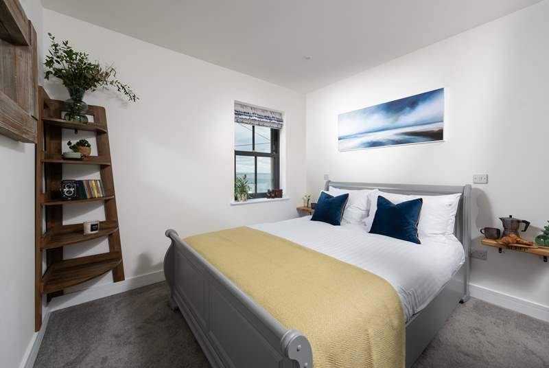 The luxurious double bedroom has sea views.