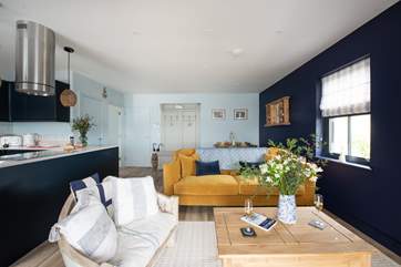 Relax on the sofa and watch a movie on the Smart TV after a busy beach day.