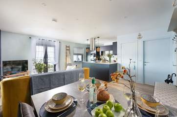The gorgeous open plan living space is beautifully styled.