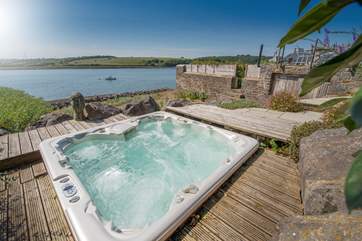 The excellent hot tub offers the ideal place to relax and enjoy the views.