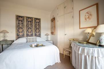 Bedroom two has wonderful high ceilings that create a grand atmosphere.