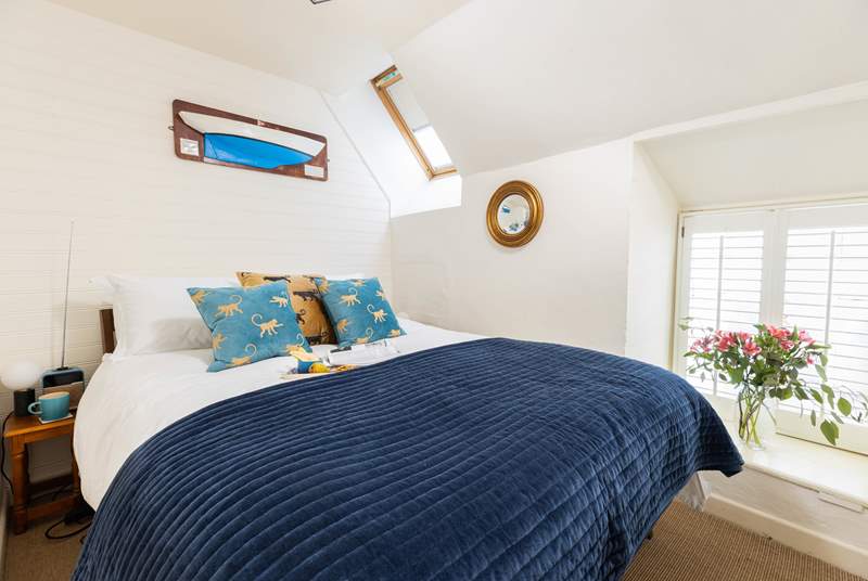 The delightful double bedroom has a king-size double bed.